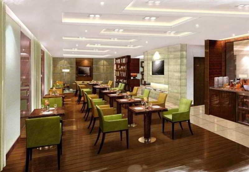 מלון נדומבסרי Courtyard By Marriott Kochi Airport מסעדה תמונה The Club Lounge at KLIA